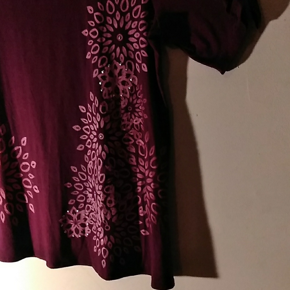 Wine colored blouse.